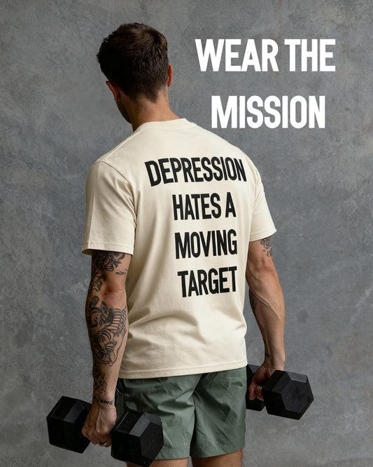 Person wearing a t-shirt with motivational text, holding dumbbells against a gray background.