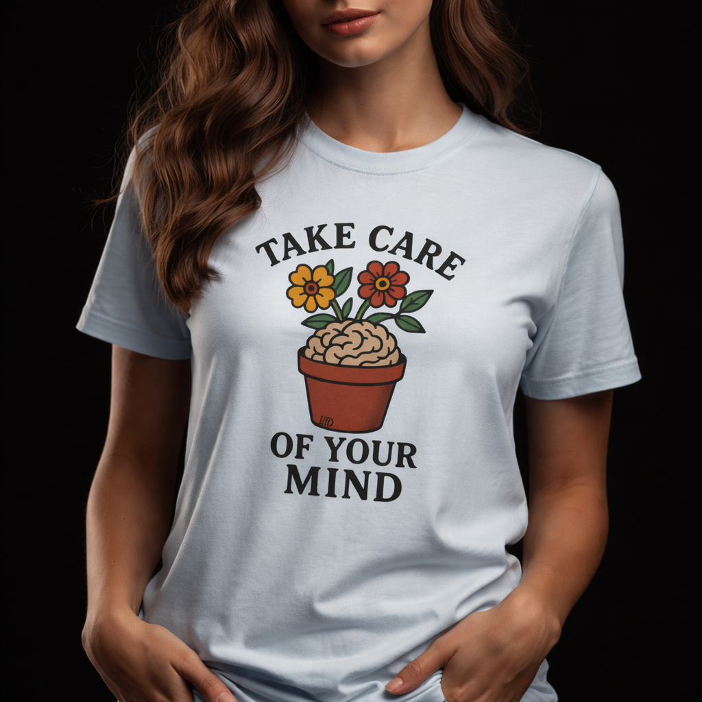 Woman wearing a white t-shirt with a motivational quote and graphic design on a black background
