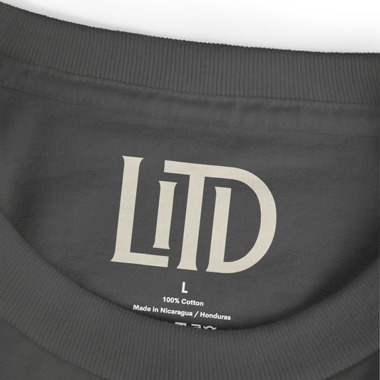 Close-up of a black shirt with 'LTD' branding and size label.