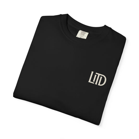 Folded black t-shirt with 'LTD' logo on a white background
