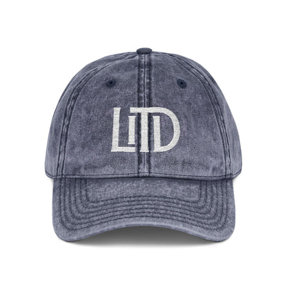 Blue denim cap with 'LTD' logo on a white background