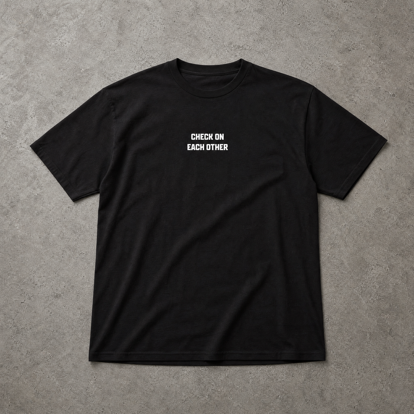 Black t-shirt with white text on a gray background