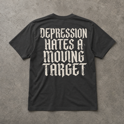 Black t-shirt with white text on a gray concrete background