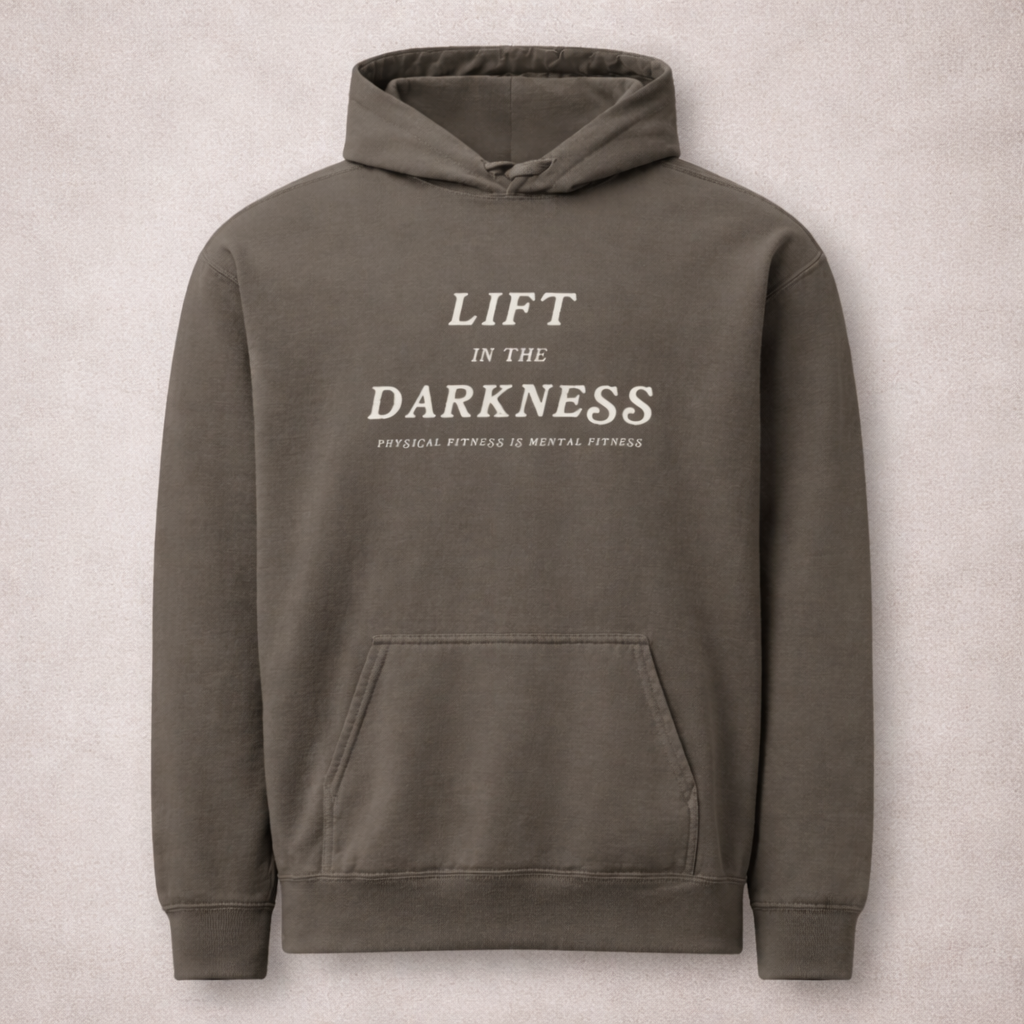 Gray hoodie with 'Lift in the Darkness' text on a beige background