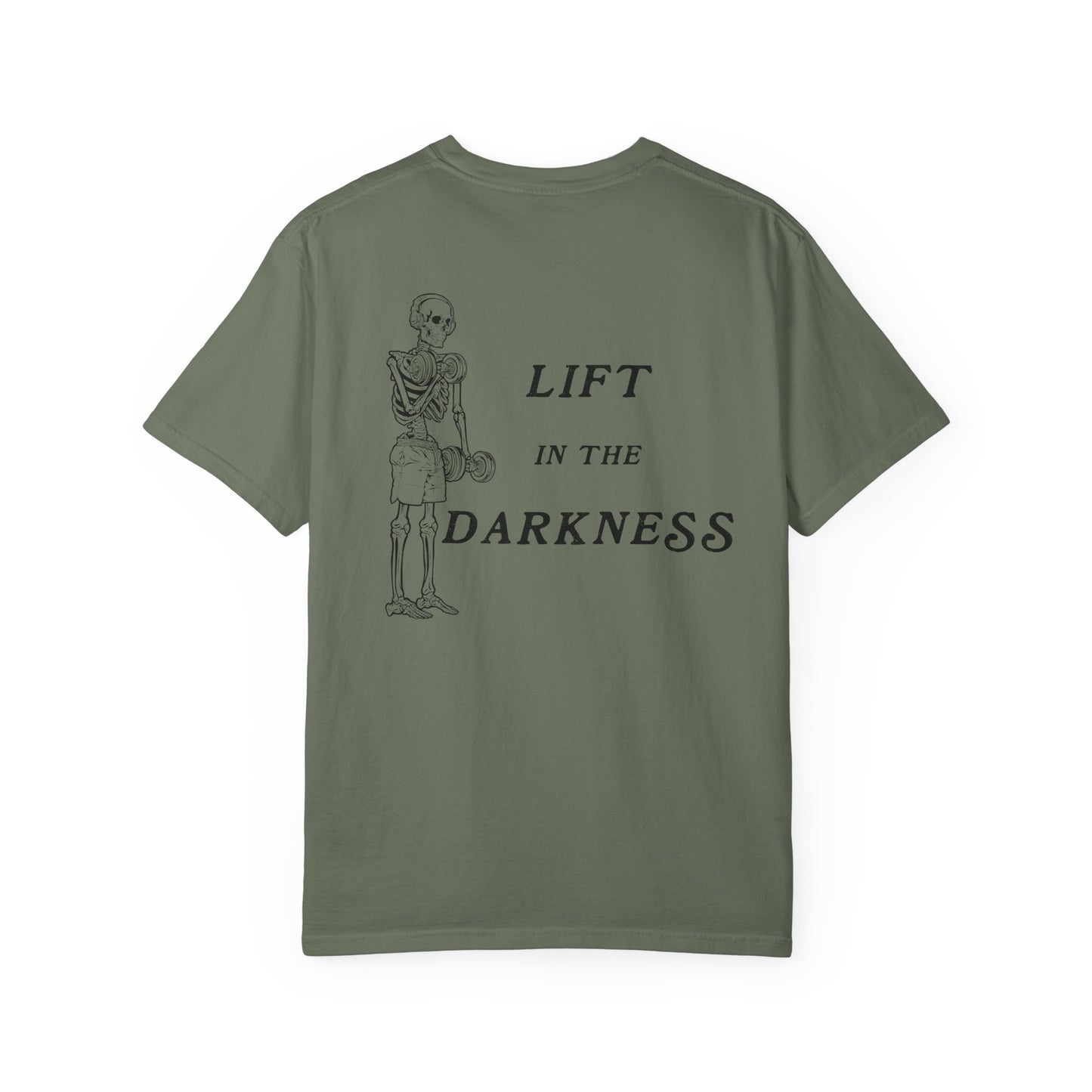 Green t-shirt with skeleton graphic and text 'Lift in the Darkness' on a white background