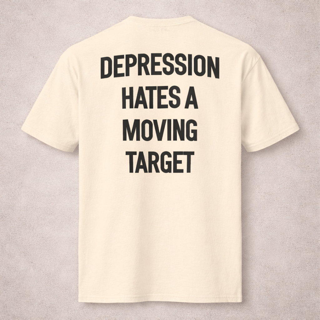 Beige t-shirt with black text on a gray background