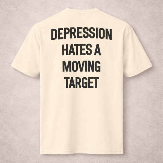 Beige t-shirt with black text on a gray background