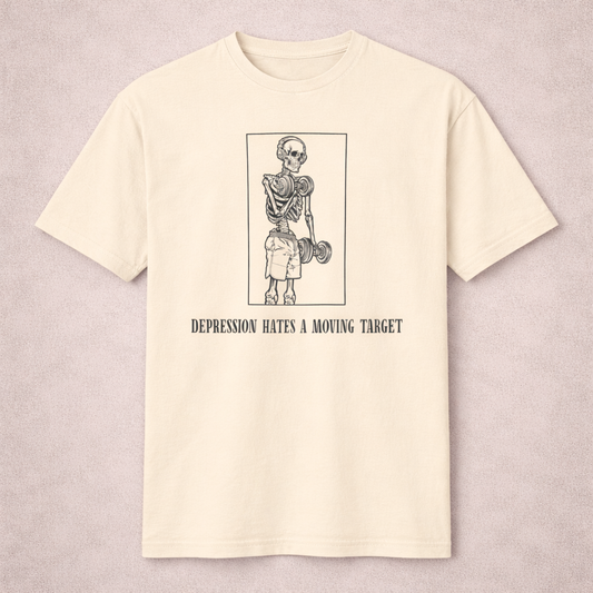 Beige t-shirt with graphic design and text on a light gray background