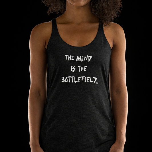Woman wearing a black tank top with 'The Mind is the Battlefield' text on a black background