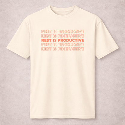 Beige t-shirt with 'REST IS PRODUCTIVE' text in red on a light gray background