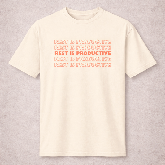Beige t-shirt with 'REST IS PRODUCTIVE' text in red on a light gray background