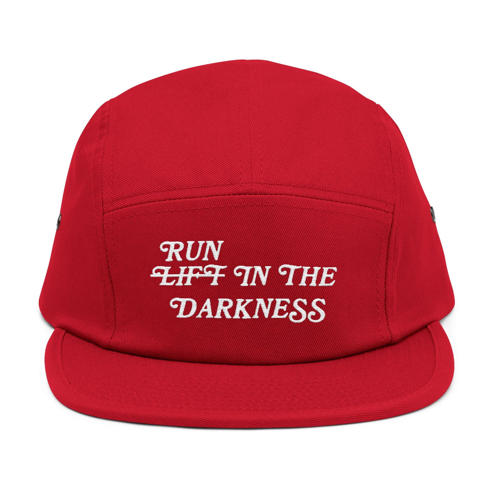 Red cap with white text 'RUN LIFT IN THE DARKNESS' on a white background